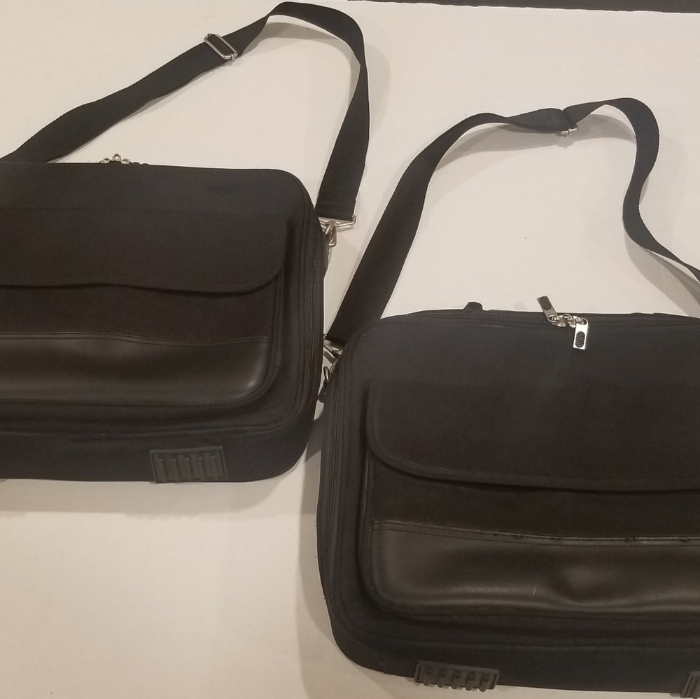 Two Black "init" 14" Laptop Cases